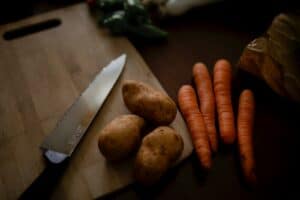 carrots on brown wooden chopping board