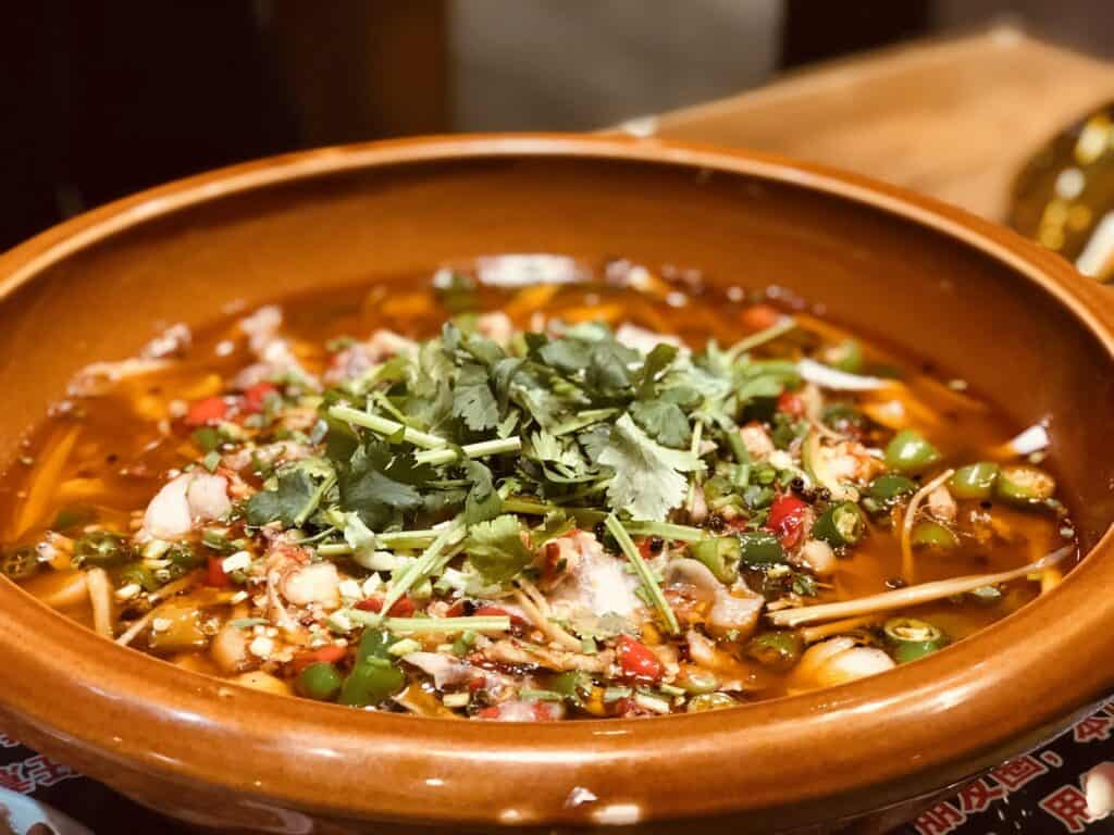 Green Basil Topped Dish in Brown Bowl, Spiced Vegetable Soup