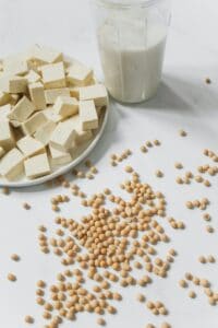 Photo of Tofu, Soybeans and Soy Milk Against White Background