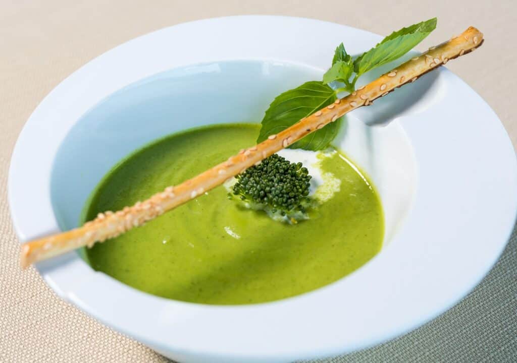 green soup in white ceramic bowl